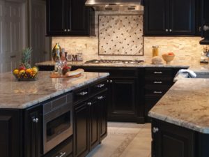 Double stacked dark wood cabinets in our client’s new kitchen! #njkitchenremodel #tilebacksplash #granitecountertops #stainlessappliances