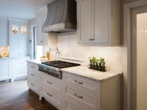 Custom inset cabinets, a unique hood and hardwood floors=perfection for our client! #njkitchendesign #customhood #whitekitchencabinets #njkitchens