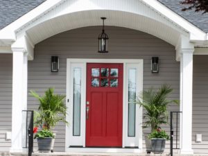 Just the right shade of red on the door of our client’s porch addition! #reddoor #njremodel #newporch #outdoorlighting #frontentry #curbappeal