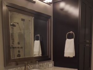 New custom vanity installed in client’s bathroom! #maplecabinetry #customvanity #njbathremodel #designnj #vanitylighting #darkwoodcabinets #granitecounters