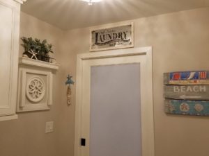 Love how this light fixture reflects off the ceiling in our client’s renovated laundry room!  #ceilinglighting #designnj  #njdesigninspiration #njkitchenremodel #laundryroom #beachhouseremodel #glasspocketdoor
