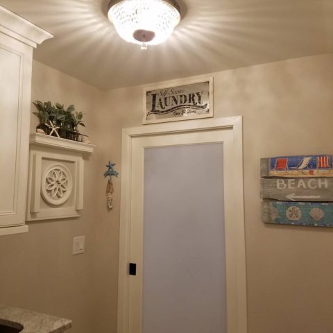 Love how this light fixture reflects off the ceiling in our client's renovated laundry room!  #ceilinglighting #designnj  #njdesigninspiration #njkitchenremodel #laundryroom #beachhouseremodel #glasspocketdoor