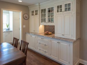 Custom buffet created for our client’s new kitchen remodel! #designnj #customcabinetry #kitchenbuffet #insetcabinets #whitekitchen #newjerseykitchendesigncenter #glasscabinetdoors #polishednickelhardware #njkitchens #kitchendesign #wallunits