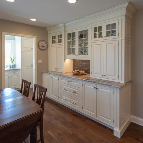 Custom buffet created for our client's new kitchen remodel! #designnj #customcabinetry #kitchenbuffet #insetcabinets #whitekitchen #newjerseykitchendesigncenter #glasscabinetdoors #polishednickelhardware #njkitchens #kitchendesign #wallunits