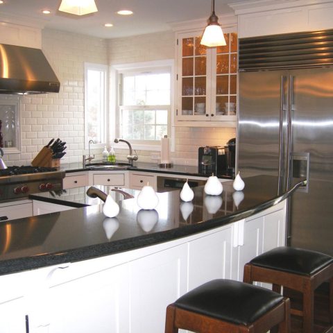 Our client's kitchen was renovated over ten years ago! A timeless design that still looks great! #whitesubwaytile #blackgranite #designnj #whitekitchencabinets #stainlessappliances #subzero #njkitchens #kitchenbaywindow