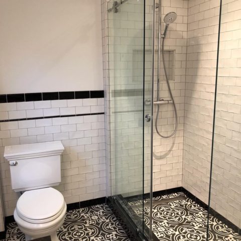 We love the floor tile in our client's newly renovated bathroom! #bathremodel #blackandwhitetiles #newjerseykitchenandbathdesigncenter #designnj