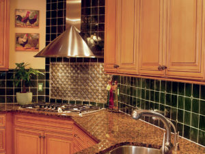 Our client’s kitchen reno still looks great after all these years! #maplecabinets #tilebacksplash #granitecountertops #stainlesshood #warmkitchen #roosterkitchen #designnj #kitchendesign #newjerseykitchenandbath