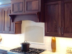 Custom @candlelight_cabinetry walnut oven hood in our client’s new kitchen renovation! #walnutcabinets #designnj #newjerseykitchensdesign #customcabinetry #woodovenhood #insetcabinets