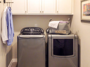 Swipe 👉🏼to see our client’s laundry room addition loaded with storage and functionality for this busy family. A tall pantry with interior large rollouts offers plenty of space for storing kitchen overflow items. White painted cabinetry with chrome pulls also house towels, sheets and other linen closet items. The granite countertops provide folding space for laundry items. The large stainless laundry room sink, with mosaic backsplash and chrome faucet, serves as a utility sink for household and gardening chores. The floors are tiled with a concrete-looking 24”x 24” porcelain tile. A 5-panel opaque laminate glass door is the finishing touch to a truly beautiful and functional laundry room space. #laundryroommakeover #laundryroom #designnj #newjerseykitchenandbath #interiordesign #stainlessappliances