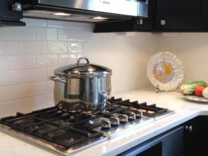 Our client’s clean and simply beautiful subway tile backsplash! #whitesubwaytile #boschmicrowave #boschhoods #quartzcountertops #shakercabinets