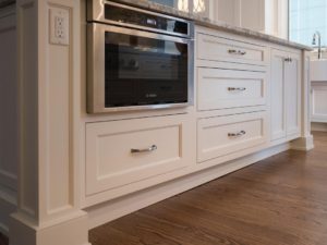 Client’s kitchen island is super functional including electrical tucked into island column! #kitchendesign #njkitchens #designnj #kitchenislanddesign #stainlessmicrowave #whitekitchen #candlelightcabinetry