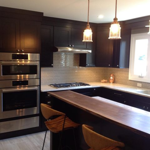 A view of our client's newly renovated kitchen! #maplecabinets #liveedgeisland #stainlessappliances #boschappliances #kitchentile #shakercabinets #kitchendesignnj #newjerseykitchens #designnj