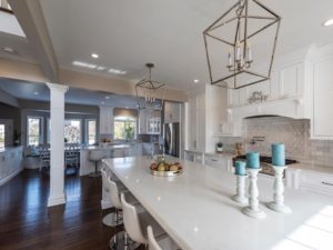 We love the island pendants in our client’s new kitchen! #designnj #njdesigns #whitekitchen #newjerseykitchenandbathshowroom #kitchencounterstools #kitchenremodel