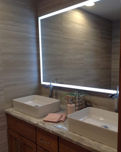 Another view of our client's newly renovated bathroom. #njbaths #newjerseybathremodel #njbathdesign #designnj #ledmirror #doublesink #granitecountertops