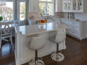 Another view of our client’s new kitchen renovation! This is the 2nd island in the space with the beverage fridge on the other side. Offers a great view of the outdoors through the bay windows. #kitchenisland #kitchenbaywindow #njkitchen #newjerseyremodelingcontractors #designnj #kitchenandbathshowroom #whitekitchencabinets