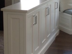 We designed this functional kneewall using custom cabinetry & a quartz top. Deep enough to store our client’s paper goods and room temp bottled water.  #customstorage #kneewall #designnj #customcabinetry #quartzcountertops #kitchendesign #njkitchendesign #whitekitchen #creativekitchen #njkitchenshowroom