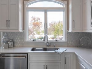 Window views in our client’s new kitchen! #newjerseydesign #newjerseyremodelingcontractors #designnj #kitchenandbathshowroom #whitequartz #whitecabinets #archedwindows #newjerseykitchenandbath