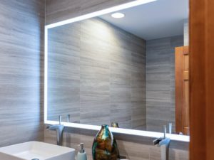 Mirror frame integrated with LED lights brightens our client’s renovated bathroom. #ledlights #ledmirrors #bathroomremodel #njbathroomdesign #designnj #newjerseydesign