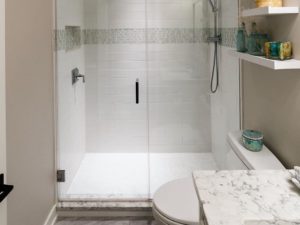 Hall bath done! #newjerseybathrenovation #njdesigner #designnj #floatingshelves #glassshowerdoors #showerdesign