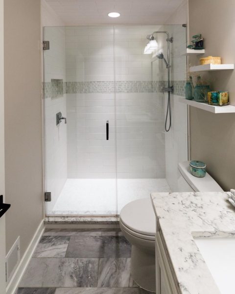 Hall bath done! #newjerseybathrenovation #njdesigner #designnj #floatingshelves #glassshowerdoors #showerdesign