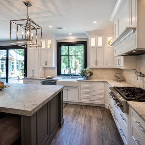 This kitchen is so ready for the Holidays! #designnj #readyforchristmas #honedgranite #twotonedkitchen #woodliketile #islandlighting #blacktrim #woodhood #tilebacksplash #kitchenisland #kitchenrenovation2019 #newjerseykitchenandbath