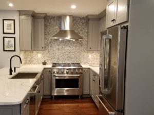 Another view of one of our favorite kitchen renovations!#woodfloors #njkitchenandbathshowroom #njkitchens #quartzcounters #designnj #graycabinets #stainlessappliances #njlife