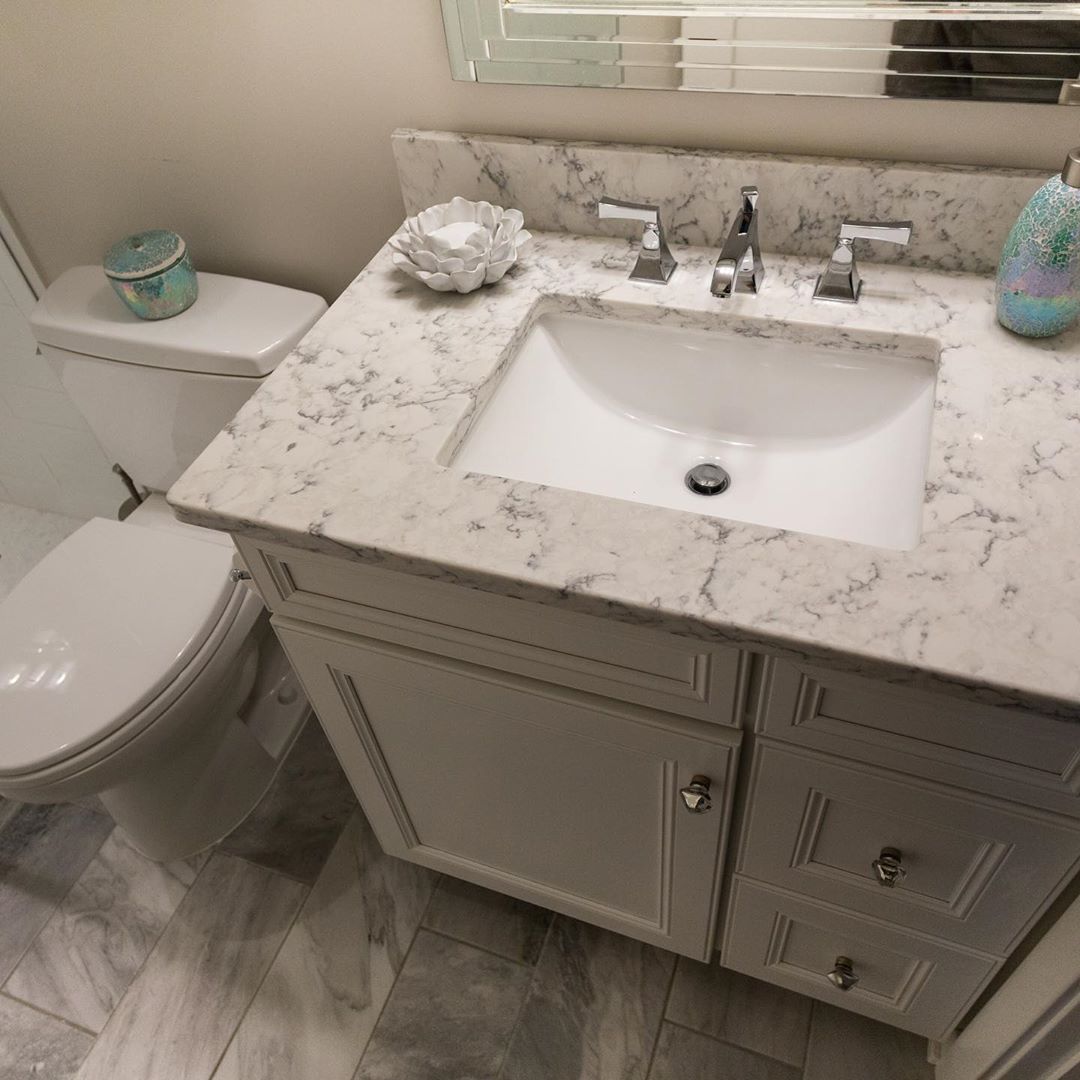 Quartz countertops tie it all together in our client’s newly renovated hall bathroom! # ...